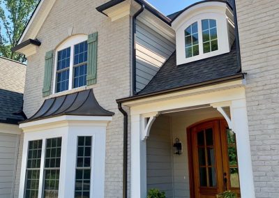 Medium brown front door and entrance area.